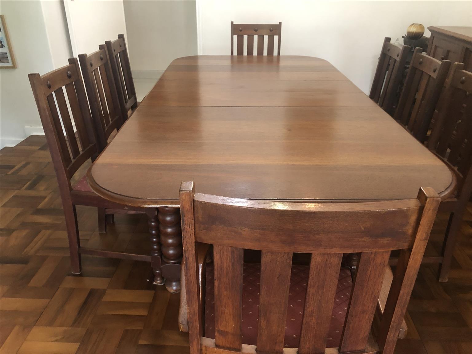Teak eight seater dining room table with sideboard cupboard and drawers. Antique