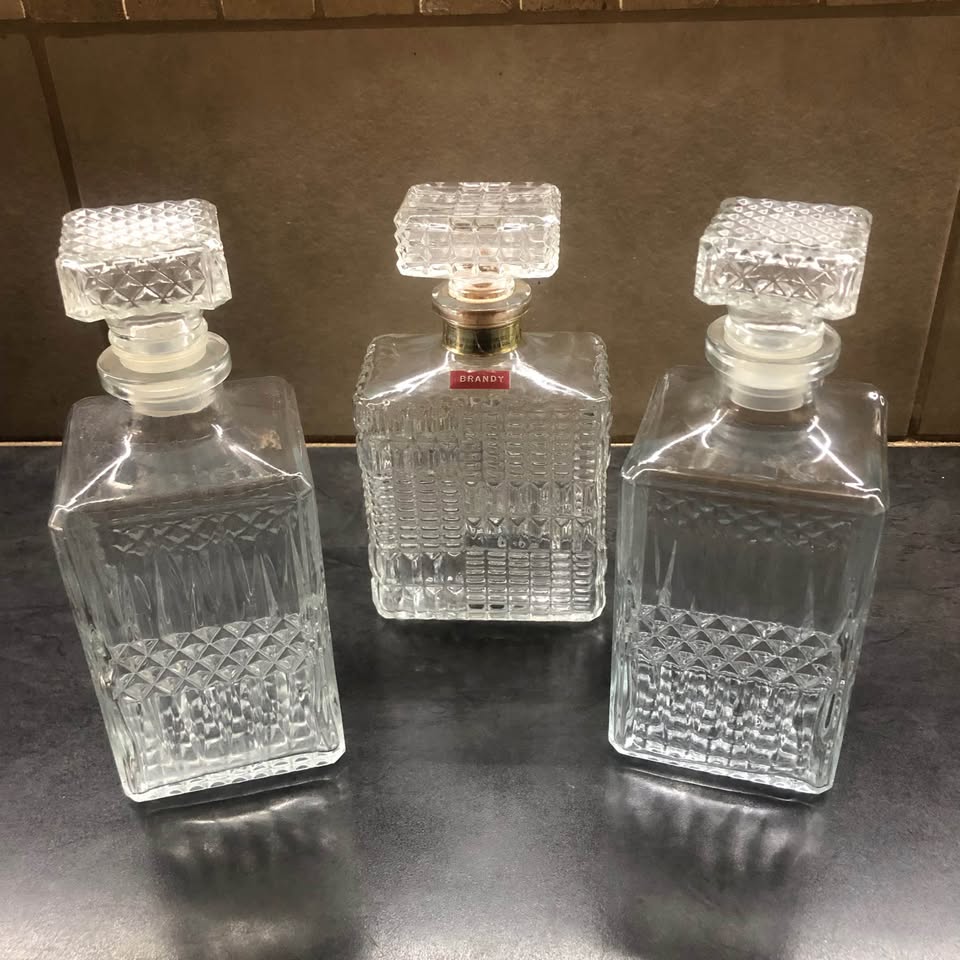 3 x Alcoholic beverage decanters. 3 x Alcoholic beverage decanters.