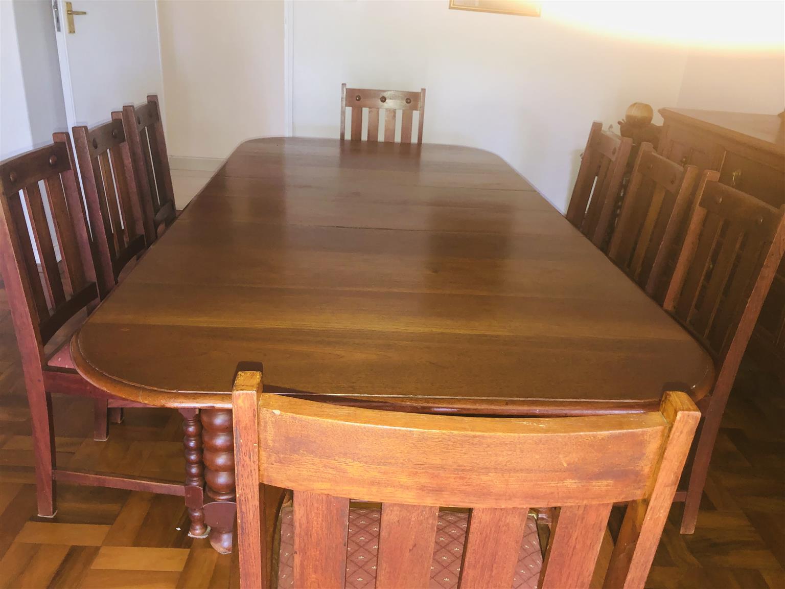 Teak eight seater dining room table with sideboard cupboard and drawers. Antique Teak eight seater dining room table with sideboard cupboard and drawers. Antique