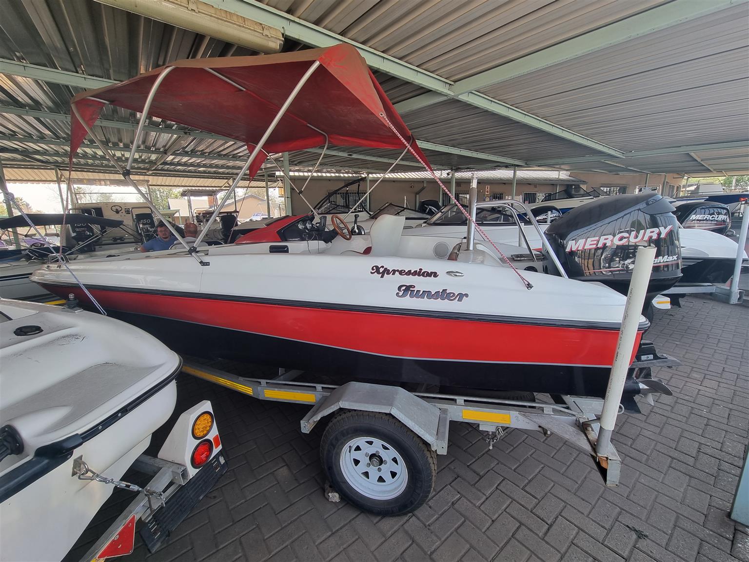18 ft Exspression Funster boat with 150 Optimax Murcury Motor