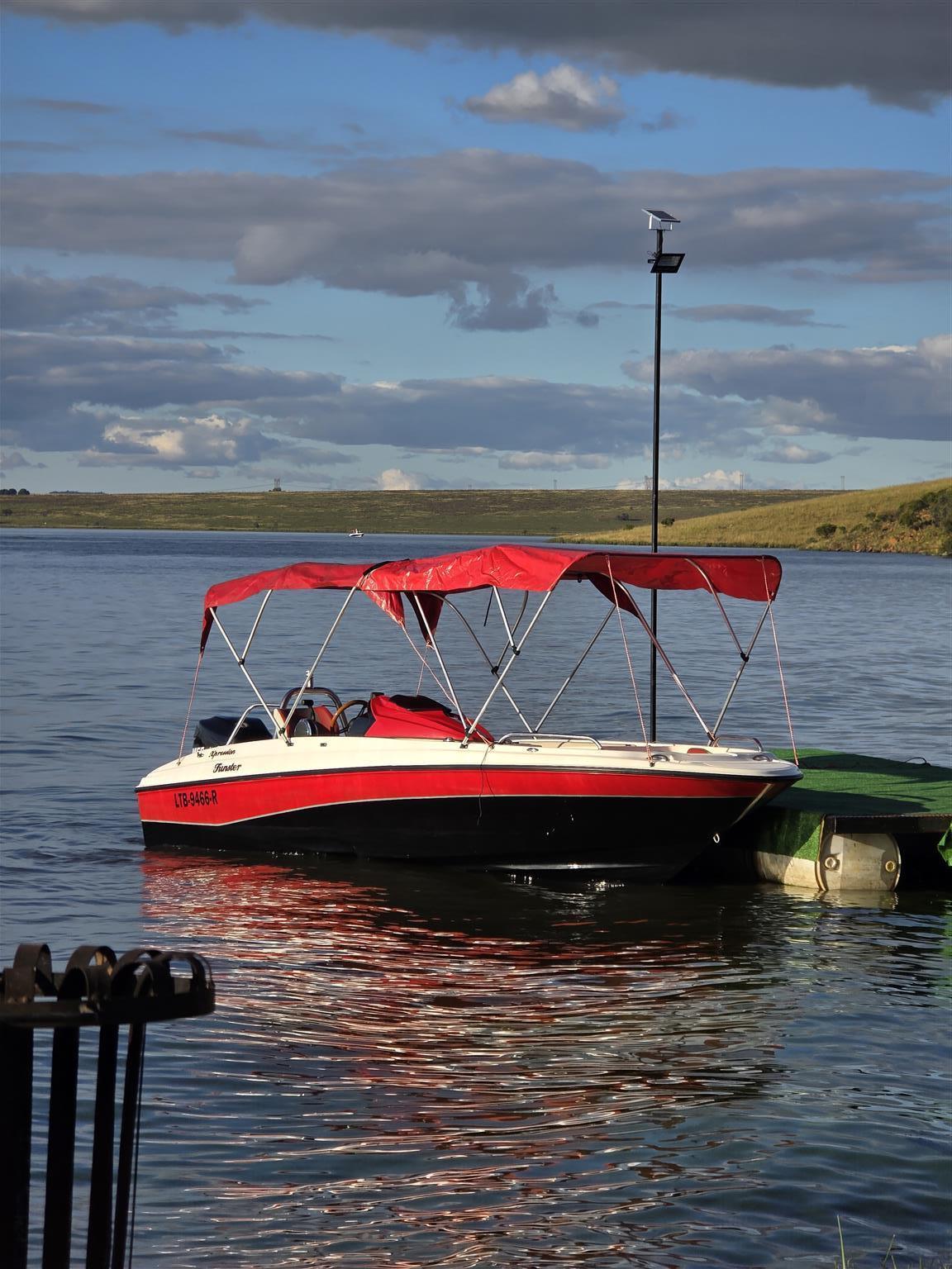 18 ft Exspression Funster boat with 150 Optimax Murcury Motor