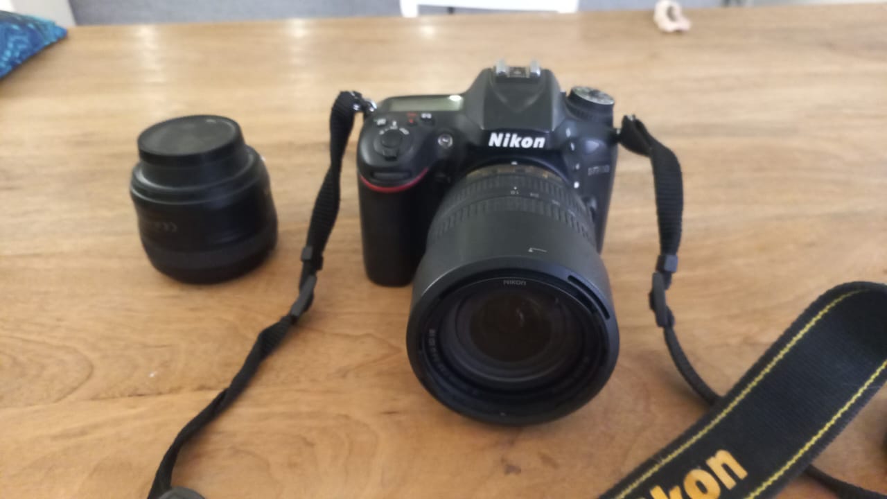 Nikon camera with lenses and battery pack