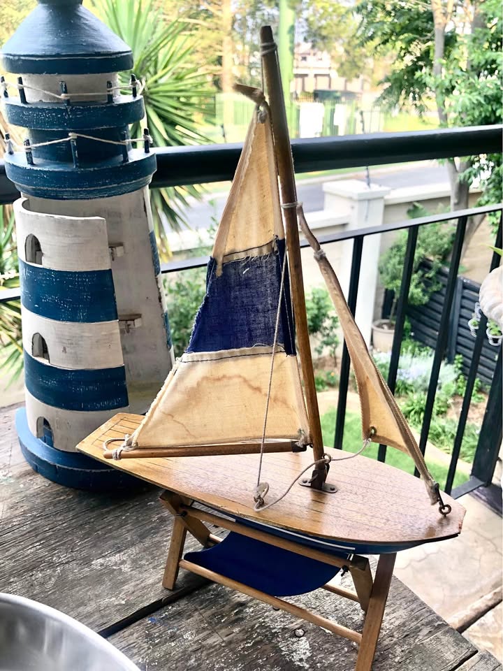 Vintage Decorative Sailing Boat on a wooden stand. Vintage Decorative Sailing Boat on a wooden stand.