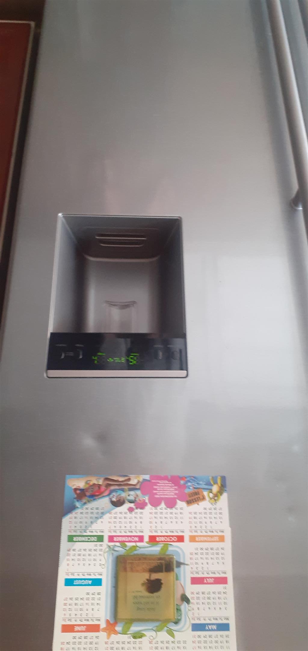Fridge-Freezer-Silver-water dispenser.