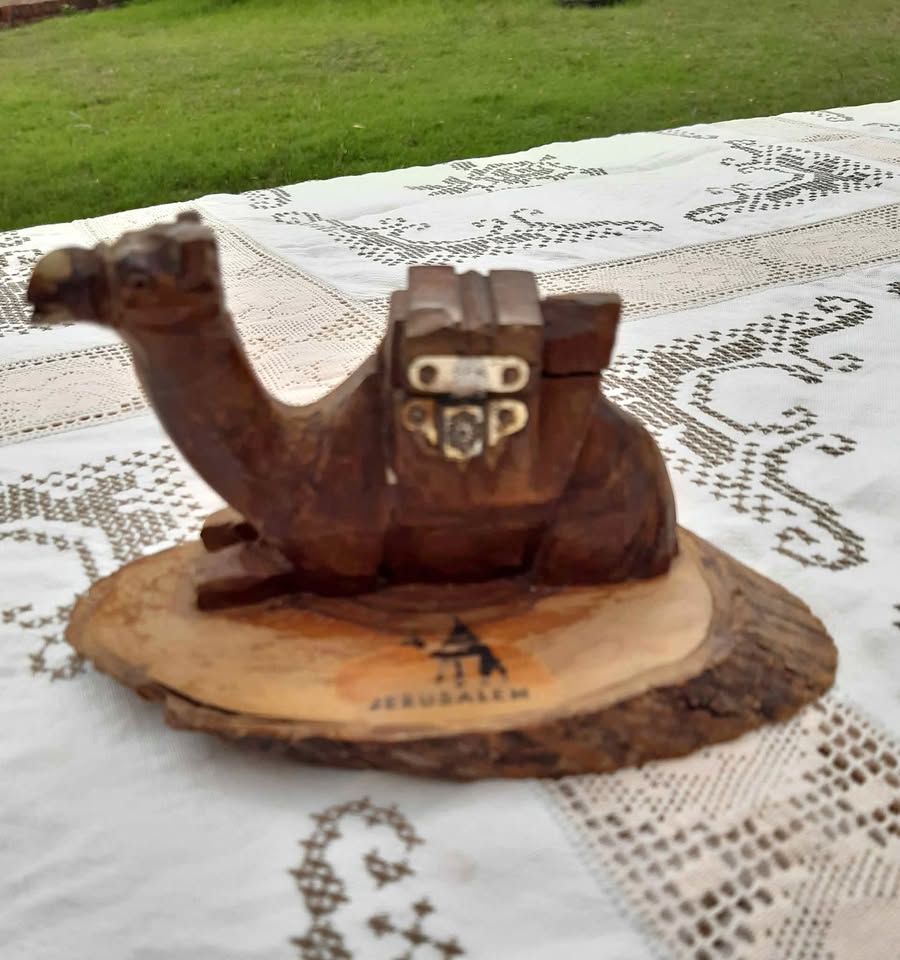 Antique hand-carved wooden camel inkwell from Jerusalem, likely dating back to around the 1920s. Antique hand-carved wooden camel inkwell from Jerusalem, likely dating back to around the 1920s.