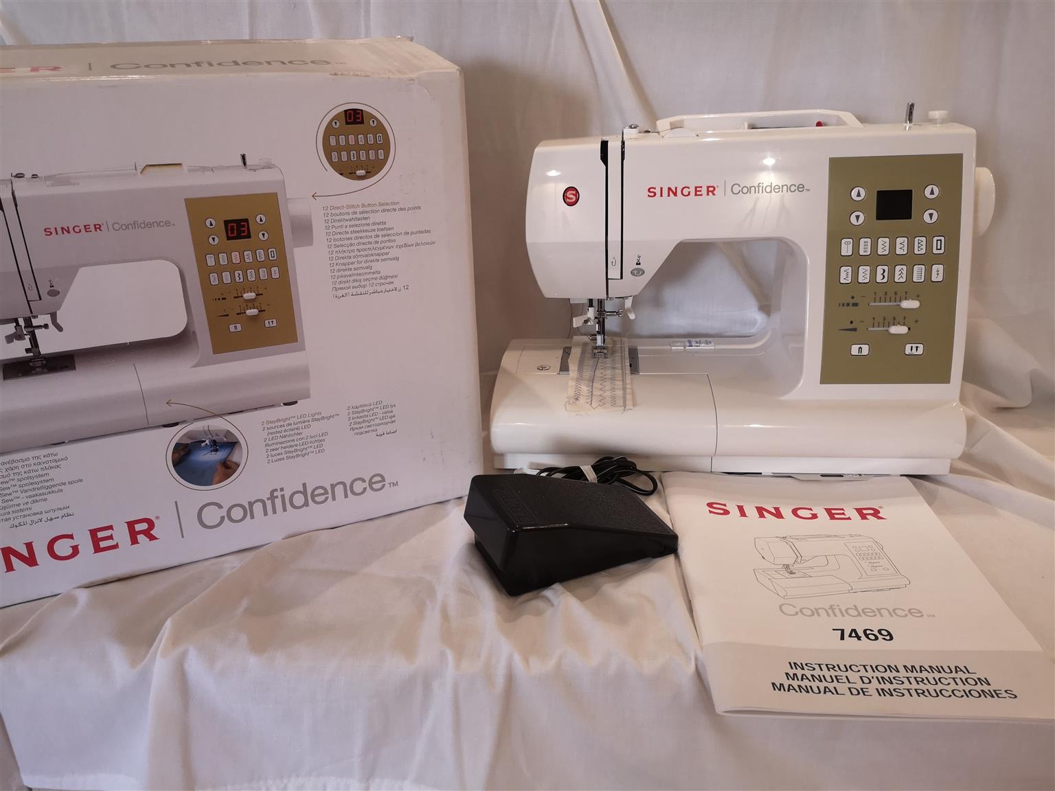 Singer Confidence sewing machine. Brand new, still in box with all accessories a