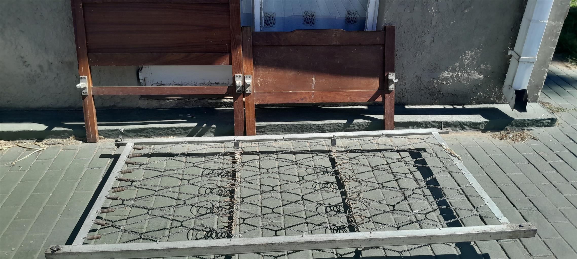 Steel single bed with wooden boards