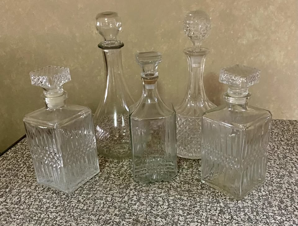 five rare vintage whiskey decanters