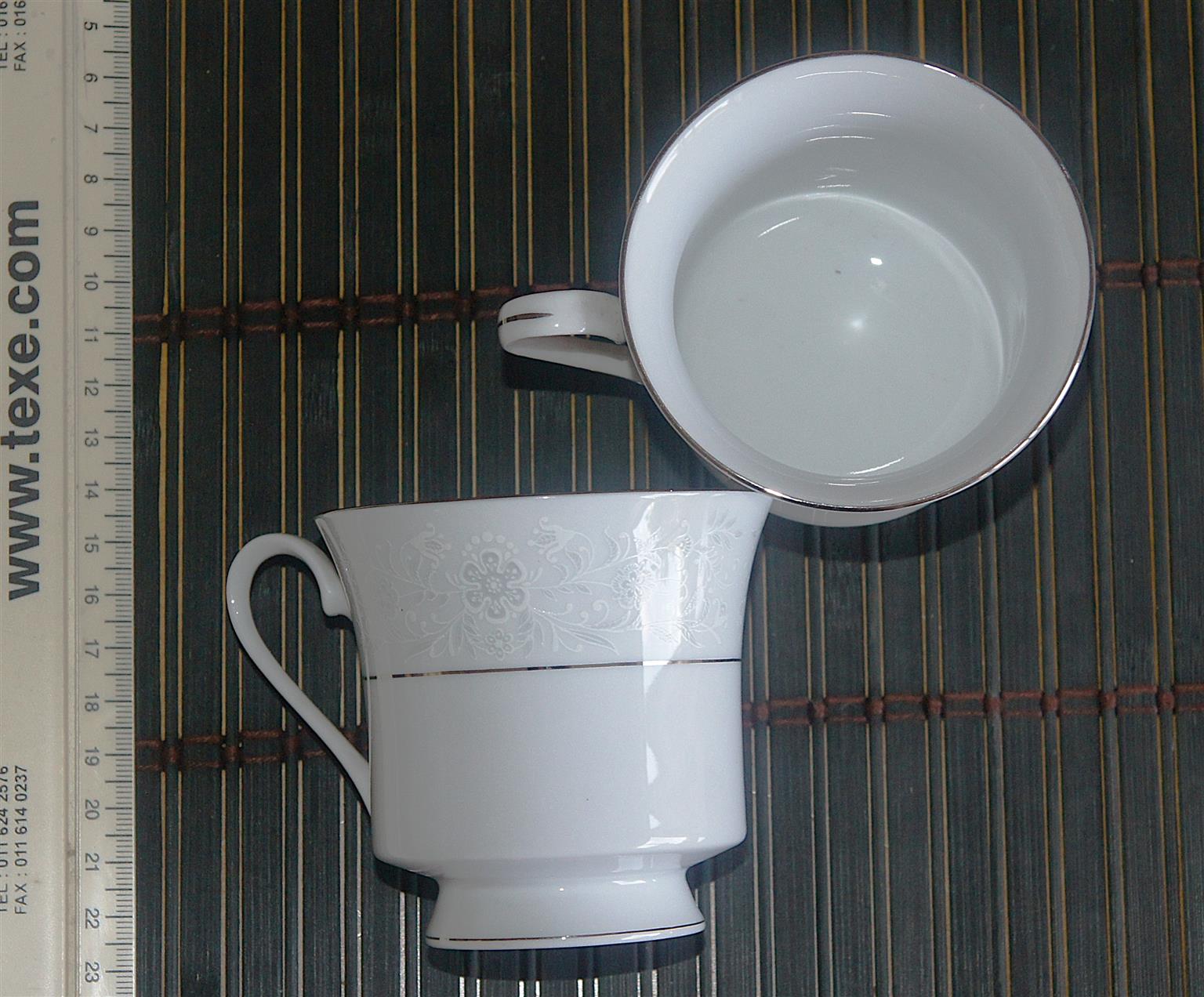 Elegantly beautiful Fine China 72 Piece Dinner Set in. Silver and White