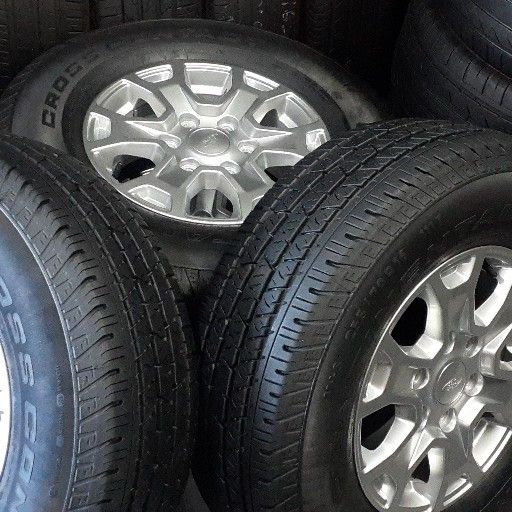 90% new fairly used Ford rims and tyre