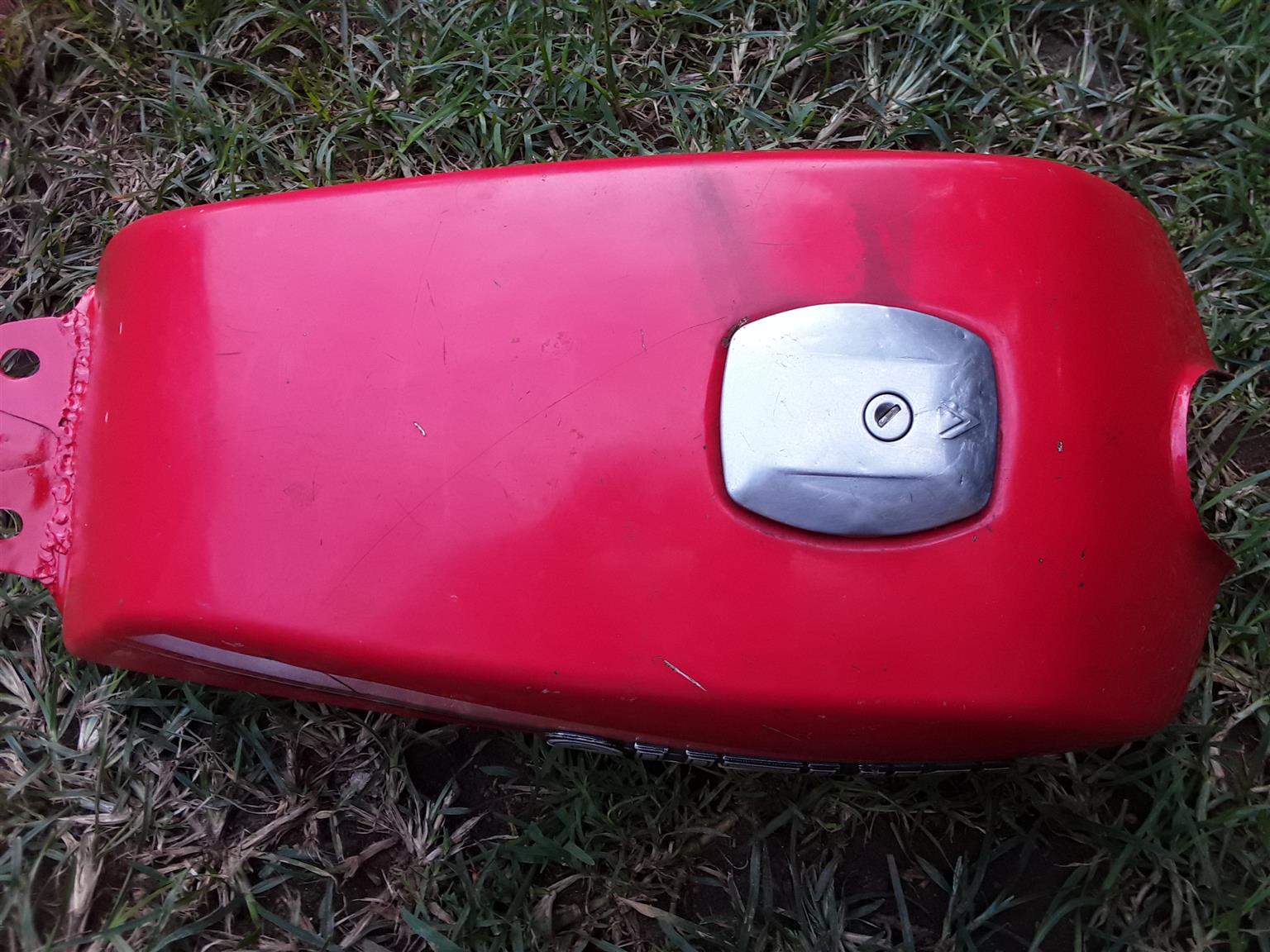 Petrol Tank for Suzuki Motor Bike. As good as new. With the fuel tap and filter. And the Fuel Cap.