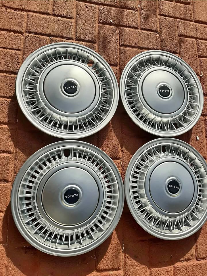 QUANTUM 14 INCH METAL WHEEL CAPS.  BRAND NEW. FOR VARIOUS OTHER CARS TOO