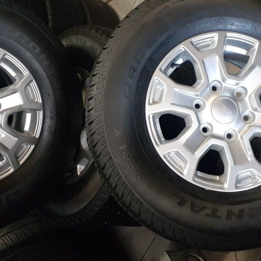 90% new fairly used Ford rims and tyre