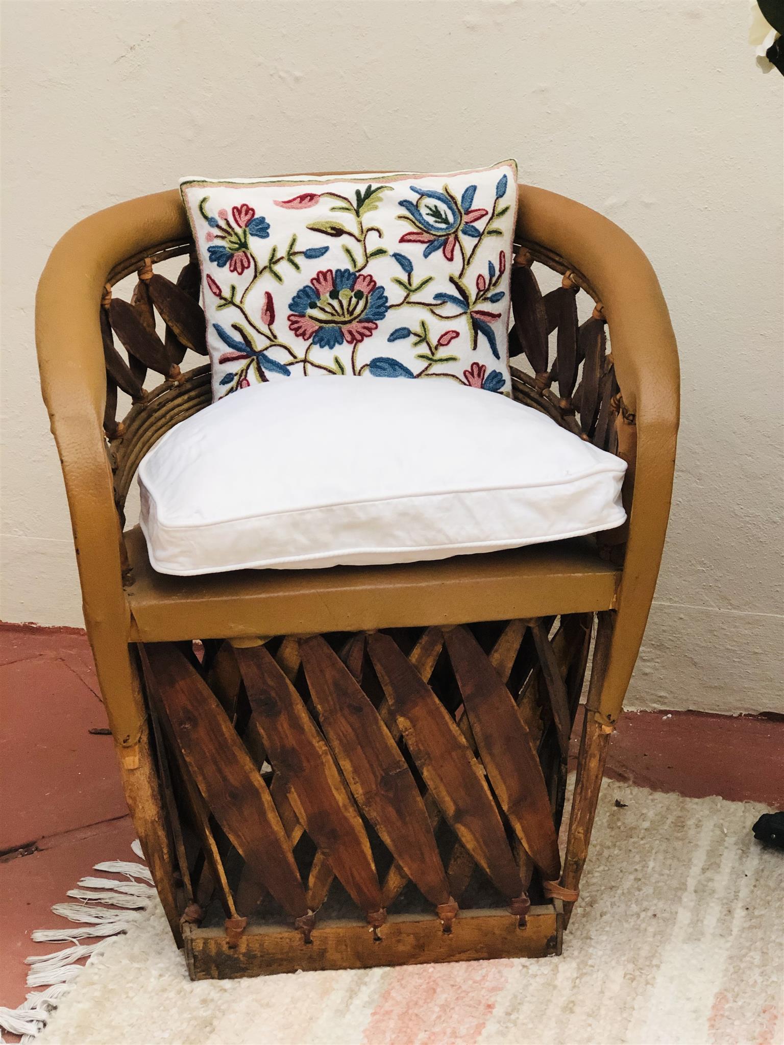 Pair of unique African carved tub chairs with genuine leather finish 