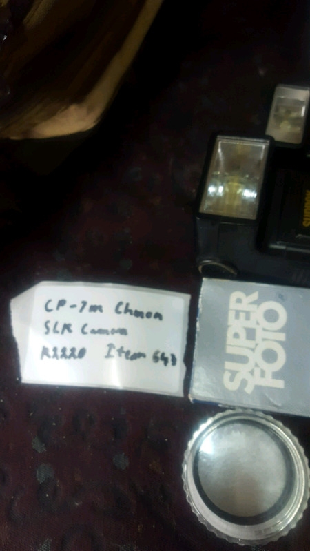 Cp 7m chinon slr camera with multiple accessories.