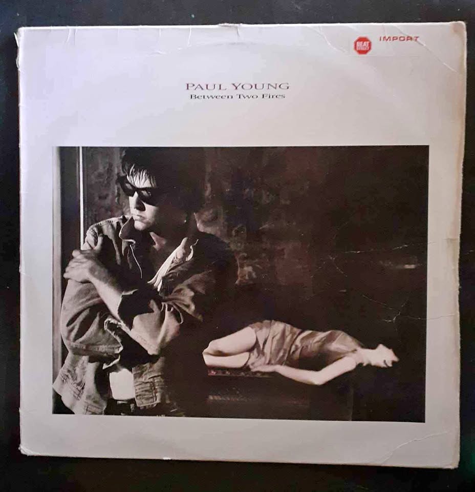 Paul Young – Between Two Fires LP Record Paul Young – Between Two Fires LP Record