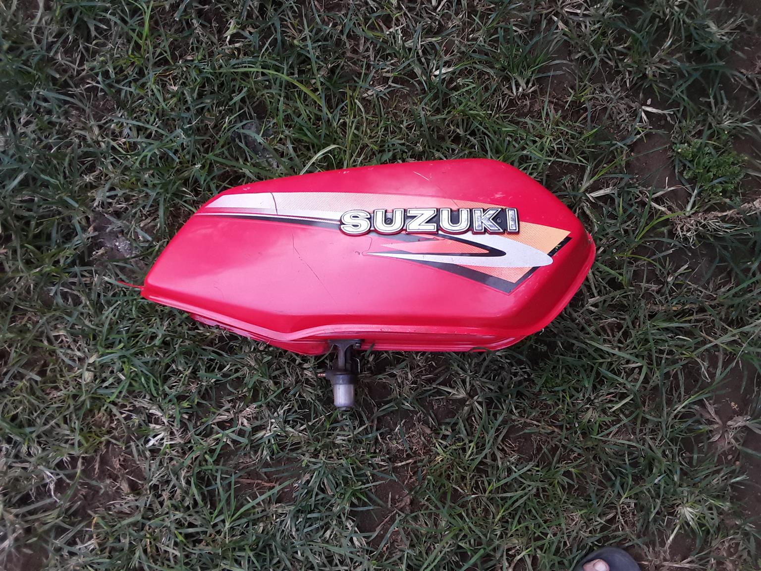 Petrol Tank for Suzuki Motor Bike. As good as new. With the fuel tap and filter. And the Fuel Cap. Petrol Tank for Suzuki Motor Bike. As good as new. With the fuel tap and filter. And the Fuel Cap.