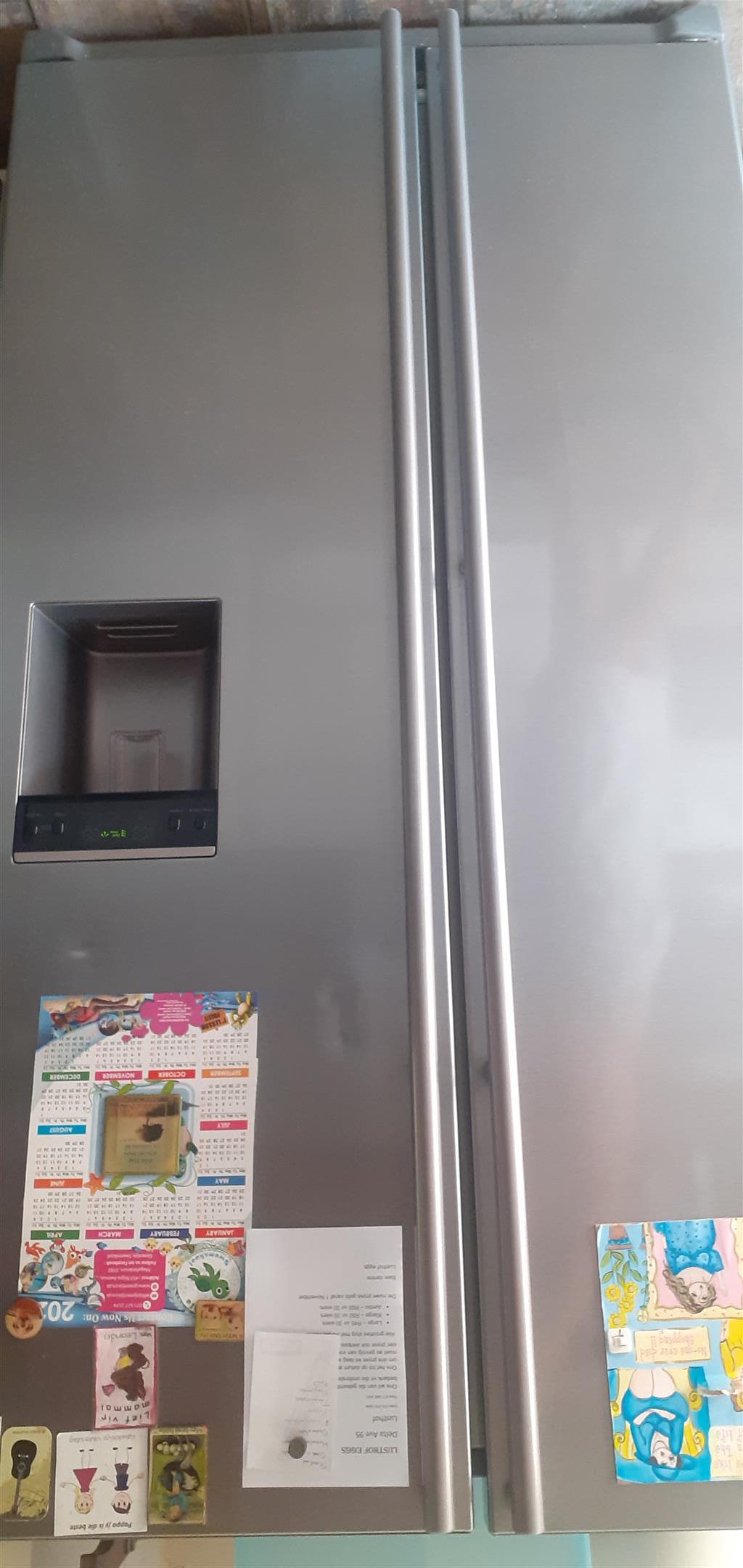 Fridge-Freezer-Silver-water dispenser.