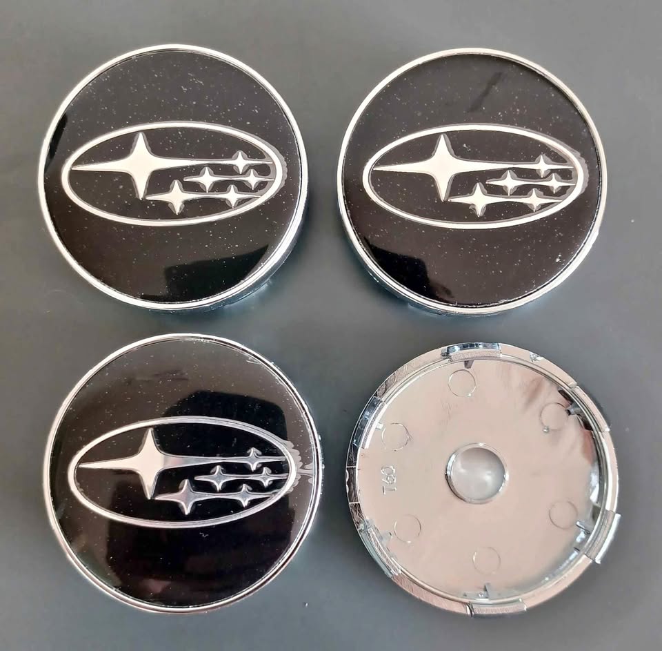 Subaru wheel rim centre caps - Private Seller