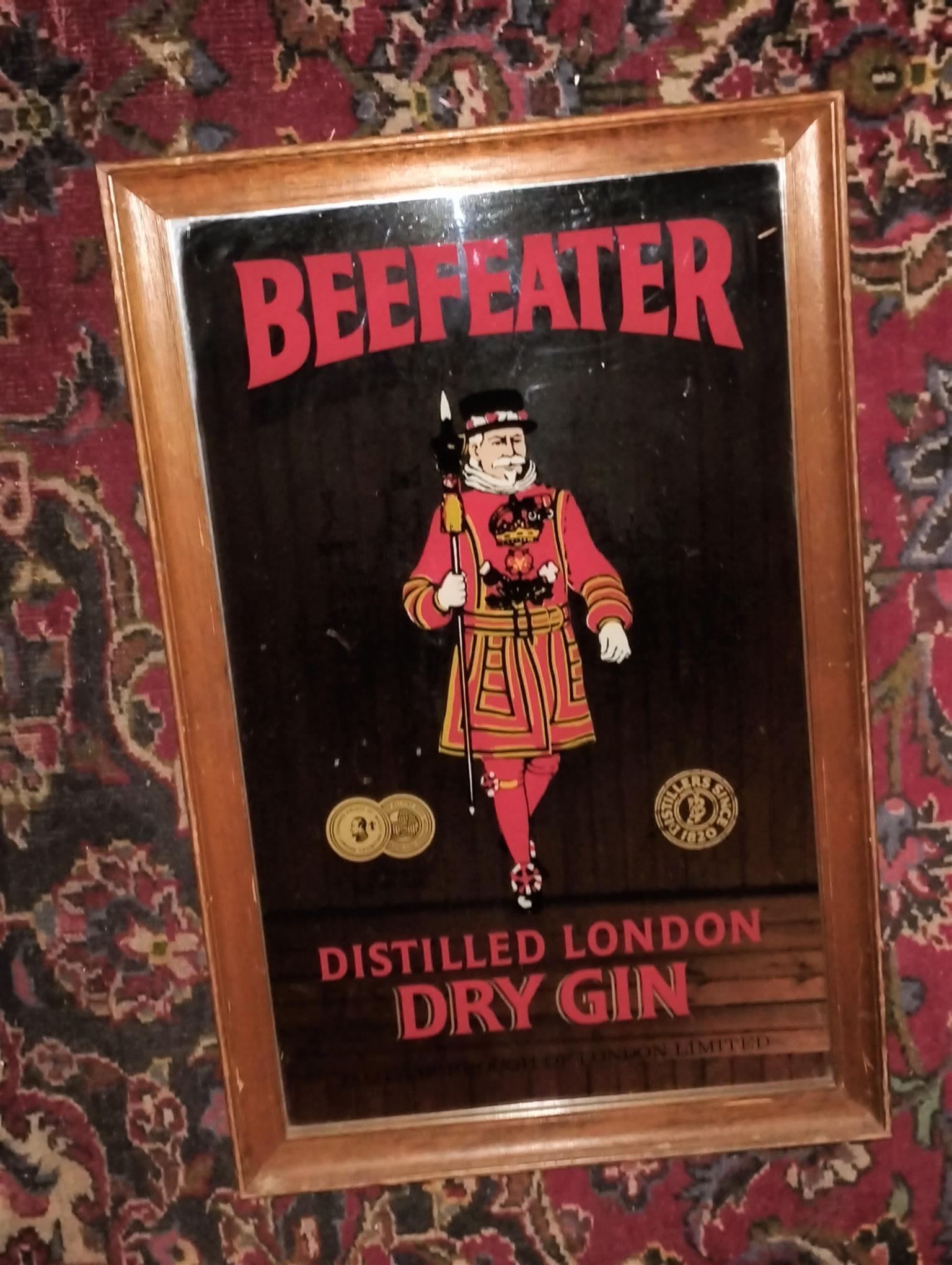 Vintage bar mirror with various alcohol logos