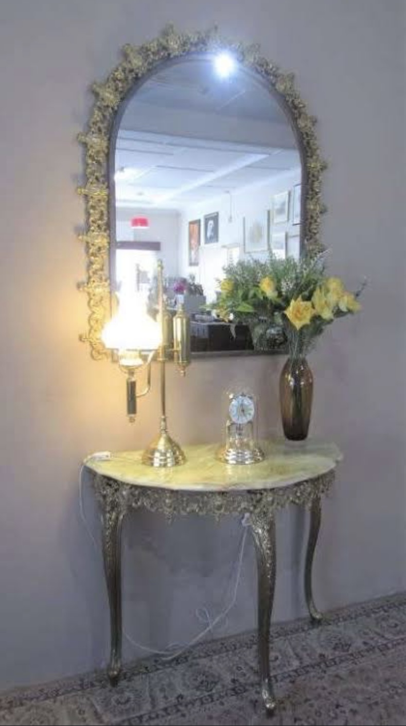 Stunning ornate moulded brass wall mirror and half moon marble table Stunning ornate moulded brass wall mirror and half moon marble table
