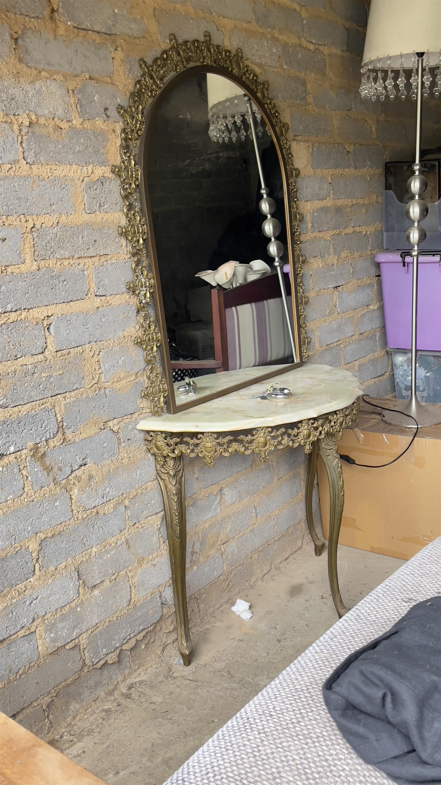Stunning ornate moulded brass wall mirror and half moon marble table