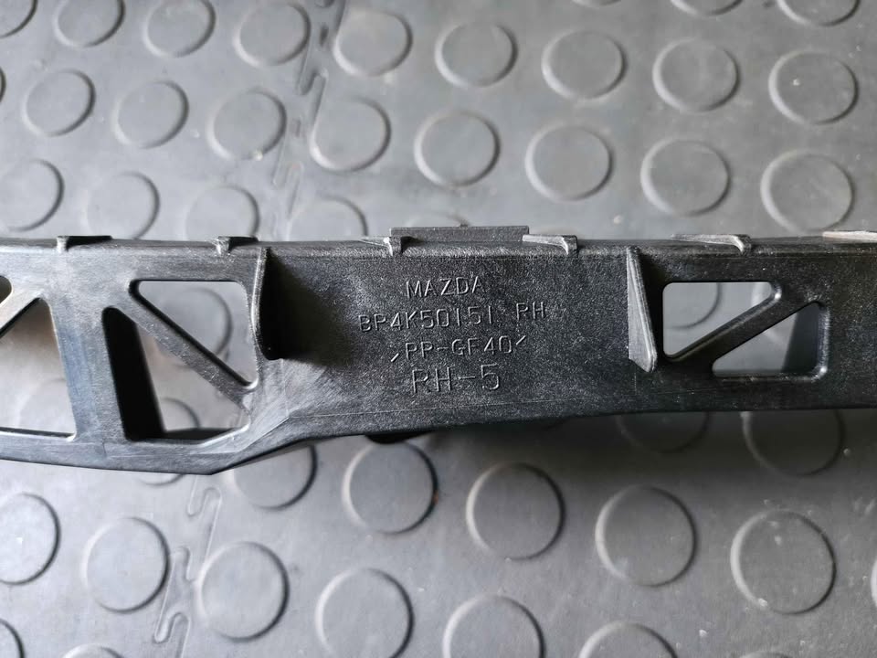 MAZDA 3 HEADLIGHT BRACKET - RHS
