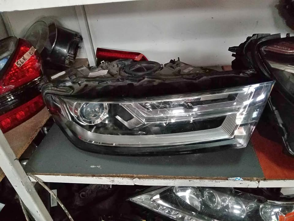 Audi Q7 Headlight  Used Auto Body Spare Parts at Sema Spare Center. Affordable - Private Seller