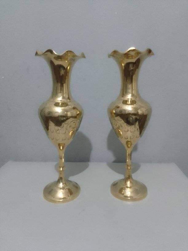 A pair of brass vases