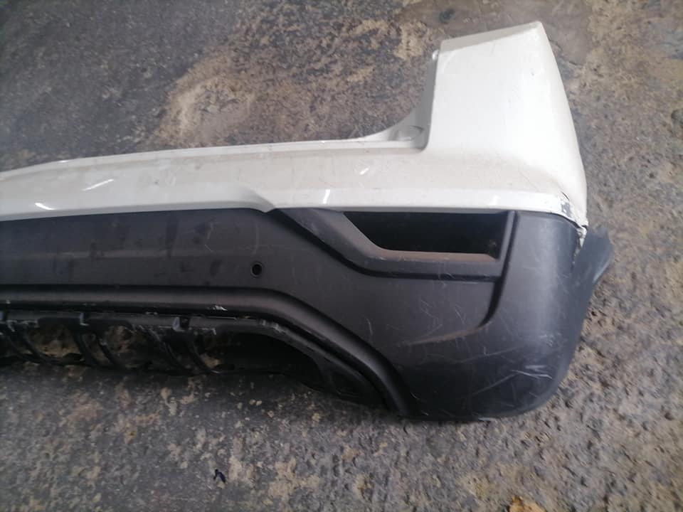 Mahindra XUV200 S200 white rear bumper DM or contact number in the description for assistance. - Private Seller