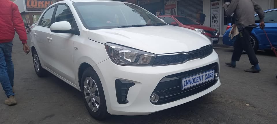 USED 2022 KIA PEGAS SEDAN 1.4 PETROL, MANUAL, WHITE COLOUR, MILEAGE 57000KM
