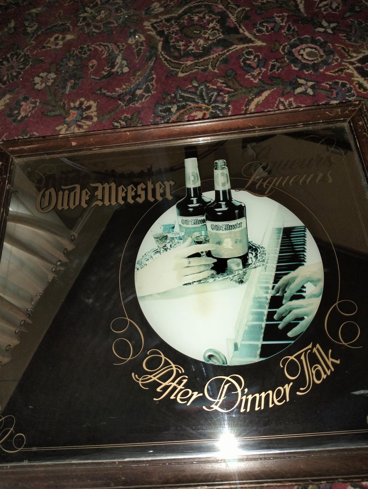 Vintage bar mirror with various alcohol logos