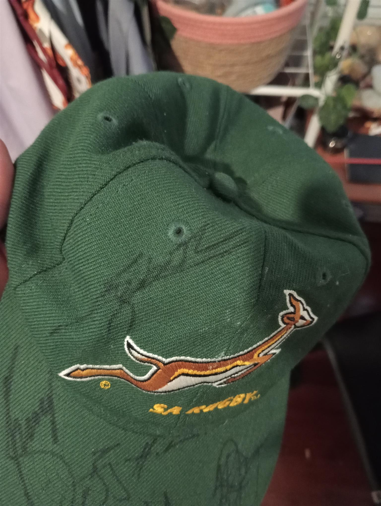 A cap signed by the springbok rugby team.