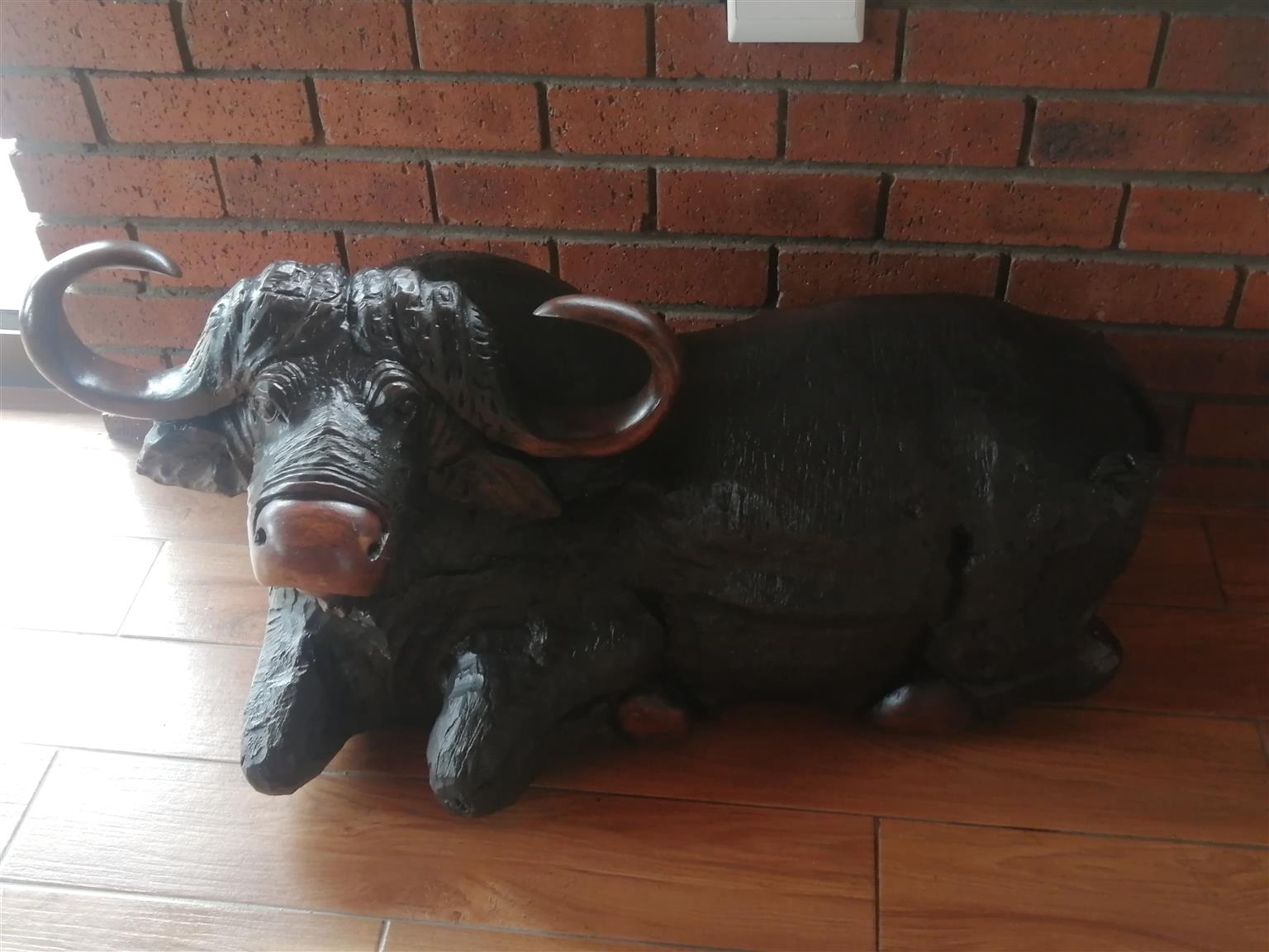 Large Wooden Animal Sculptures. Pair of Buffaloes carved from solid iron wood.