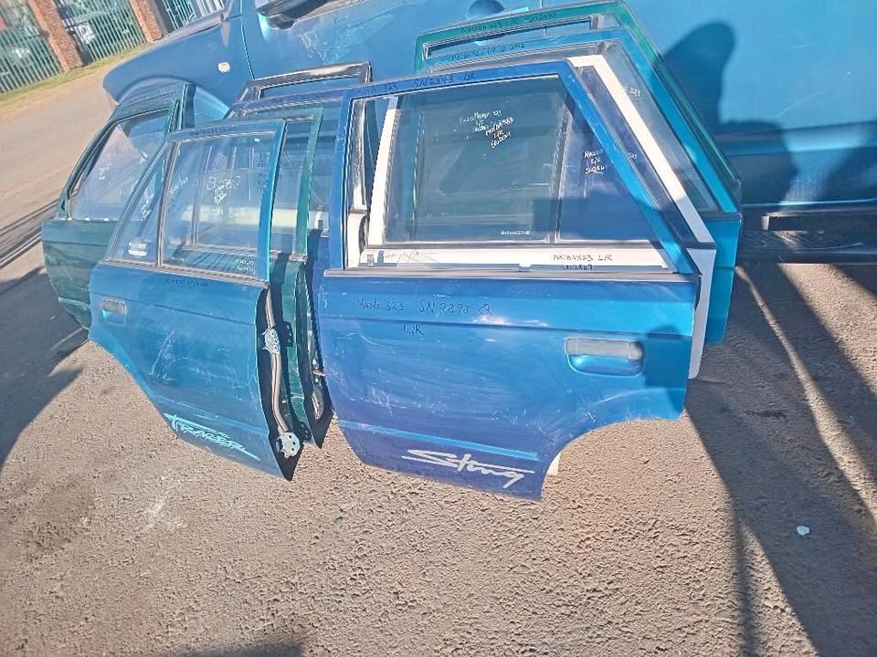 Mazda 323 doors front and rear for sale my number WhatsApp or cell