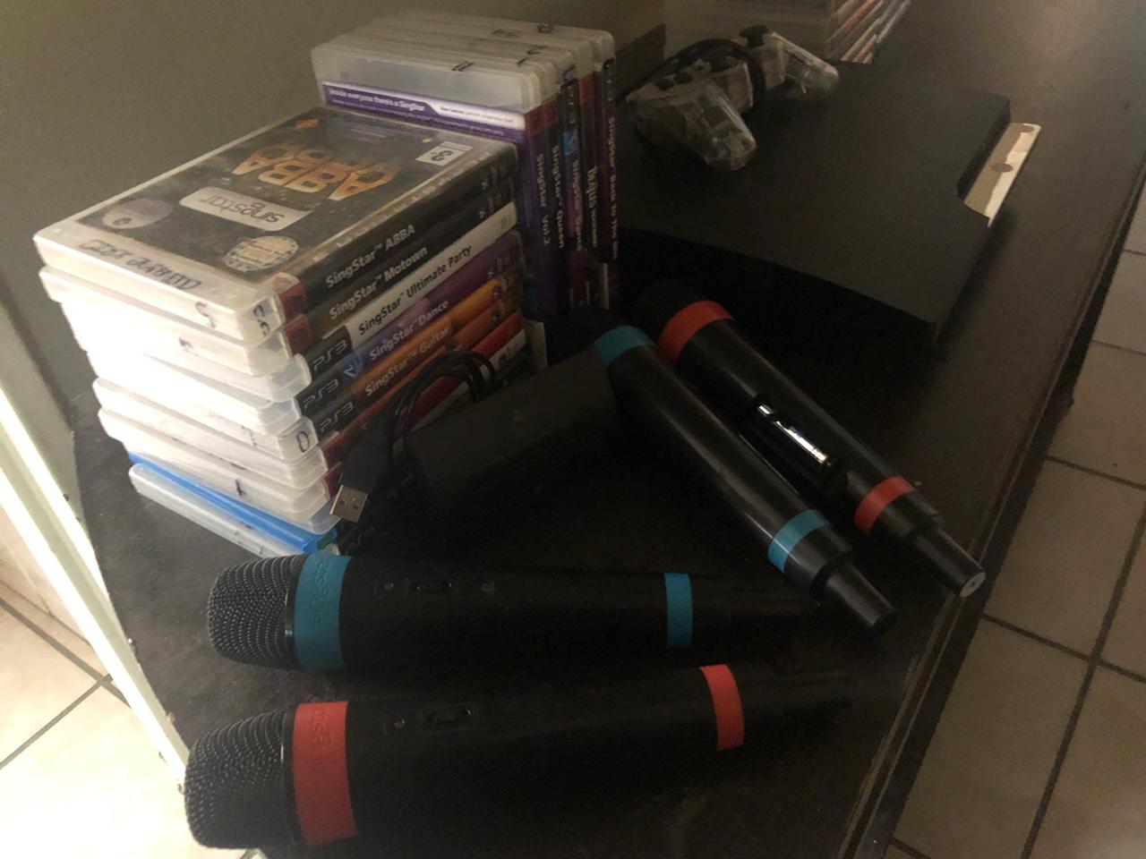 PS3 with all its gamesc+singstar and singstar mics