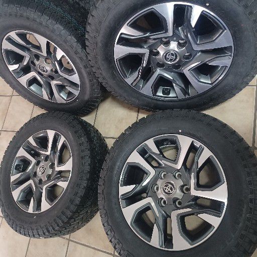 Toyota fortuna rims and general grabber at3