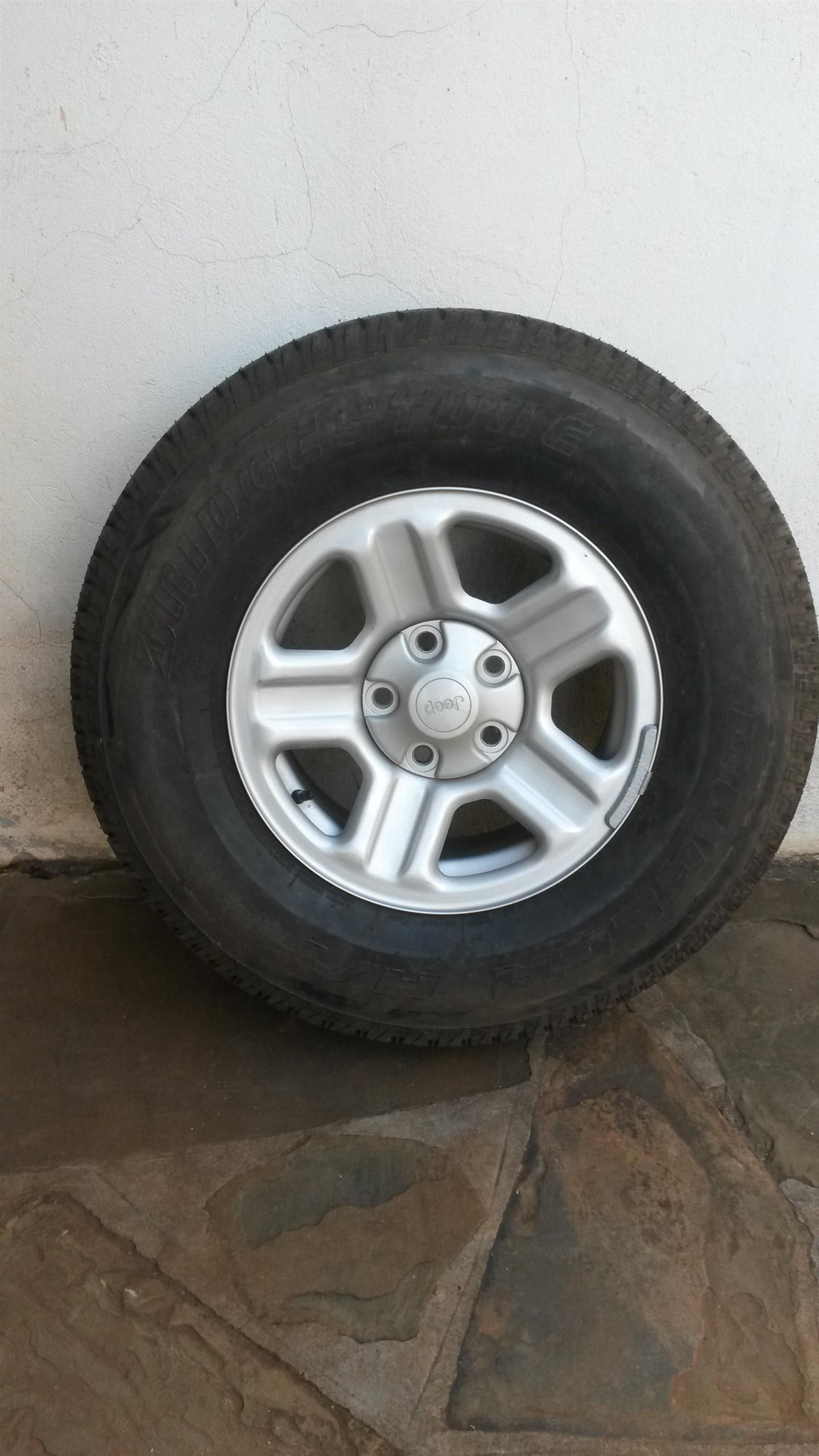 Jeep Wrangler 16inch mags with Bridgestone Dueler 245/75R16 tyres. - Private Seller Jeep Wrangler 16inch mags with Bridgestone Dueler 245/75R16 tyres. - Private Seller