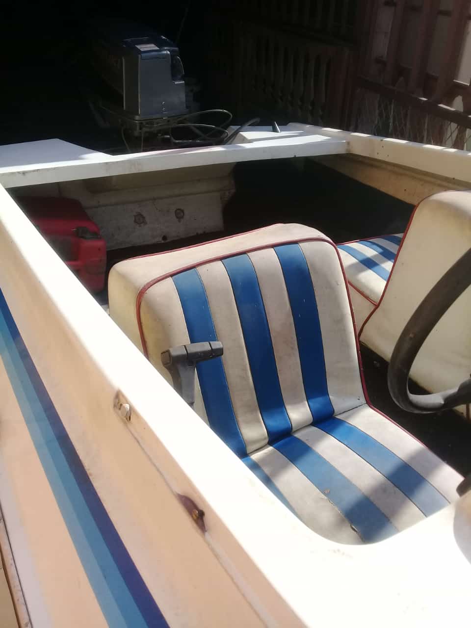 Motorboat with 40 cc Suzuki outboard motor and trailer