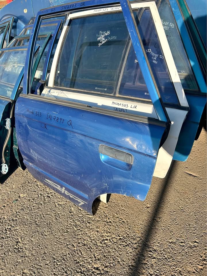 Mazda 323 Left Rear Doors For Sale Call or Whatsapp Mazda 323 Left Rear Doors For Sale Call or Whatsapp