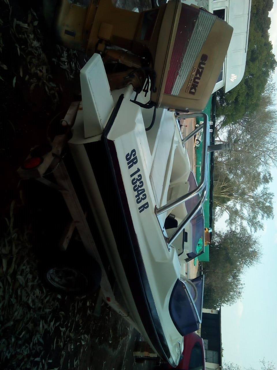 Xtaski boat with 200 motor, in running condition, on trailer