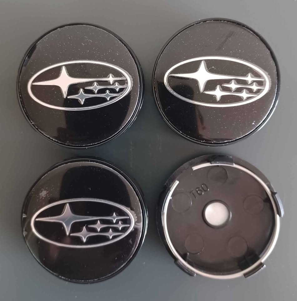 Subaru wheel rim centre caps - Private Seller