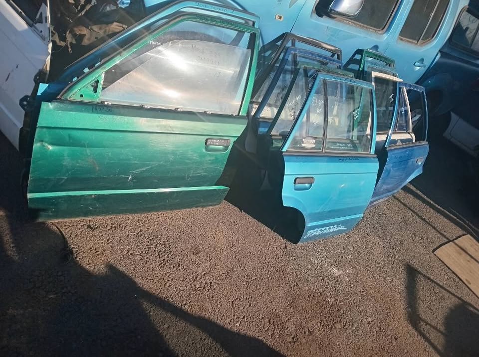 Mazda 323 doors front and rear for sale my number WhatsApp or cell