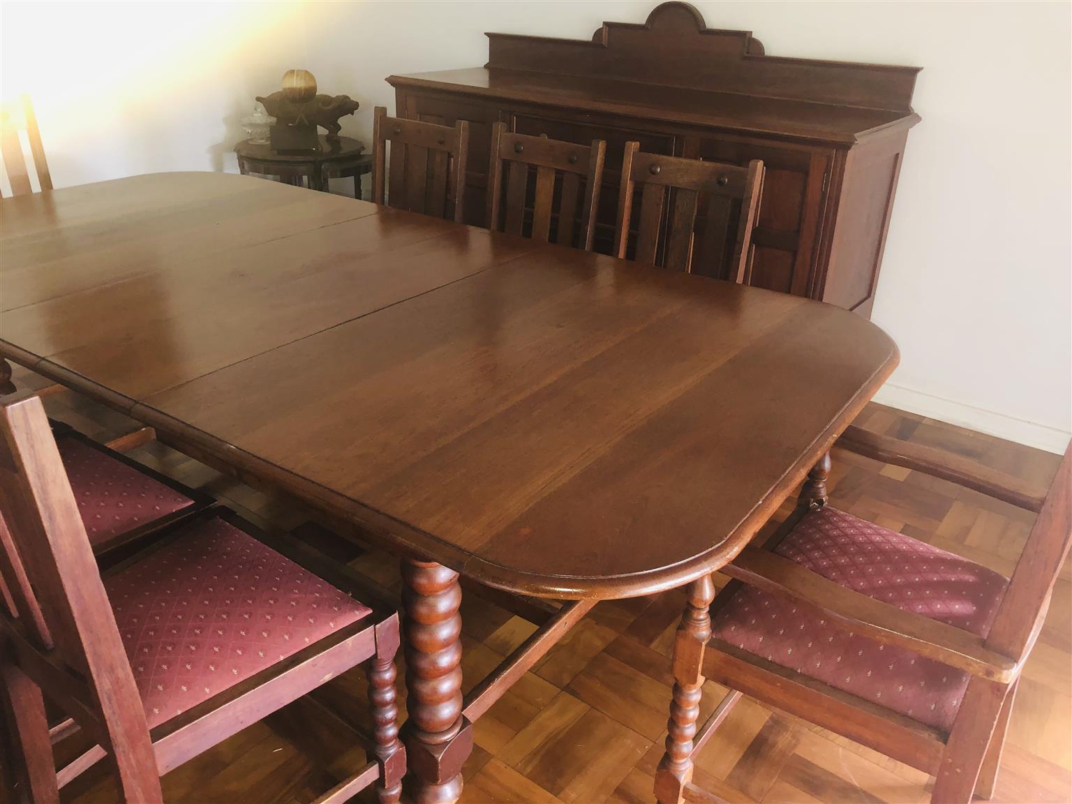 Teak eight seater dining room table with sideboard cupboard and drawers. Antique
