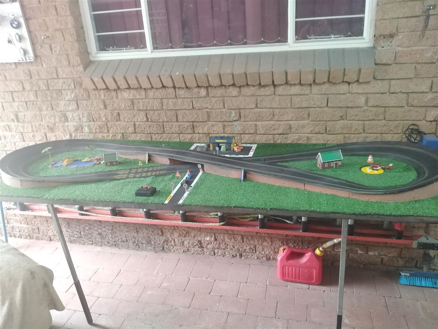 Scalectric track mounted on foldaway table. Propper track out of the 70's.