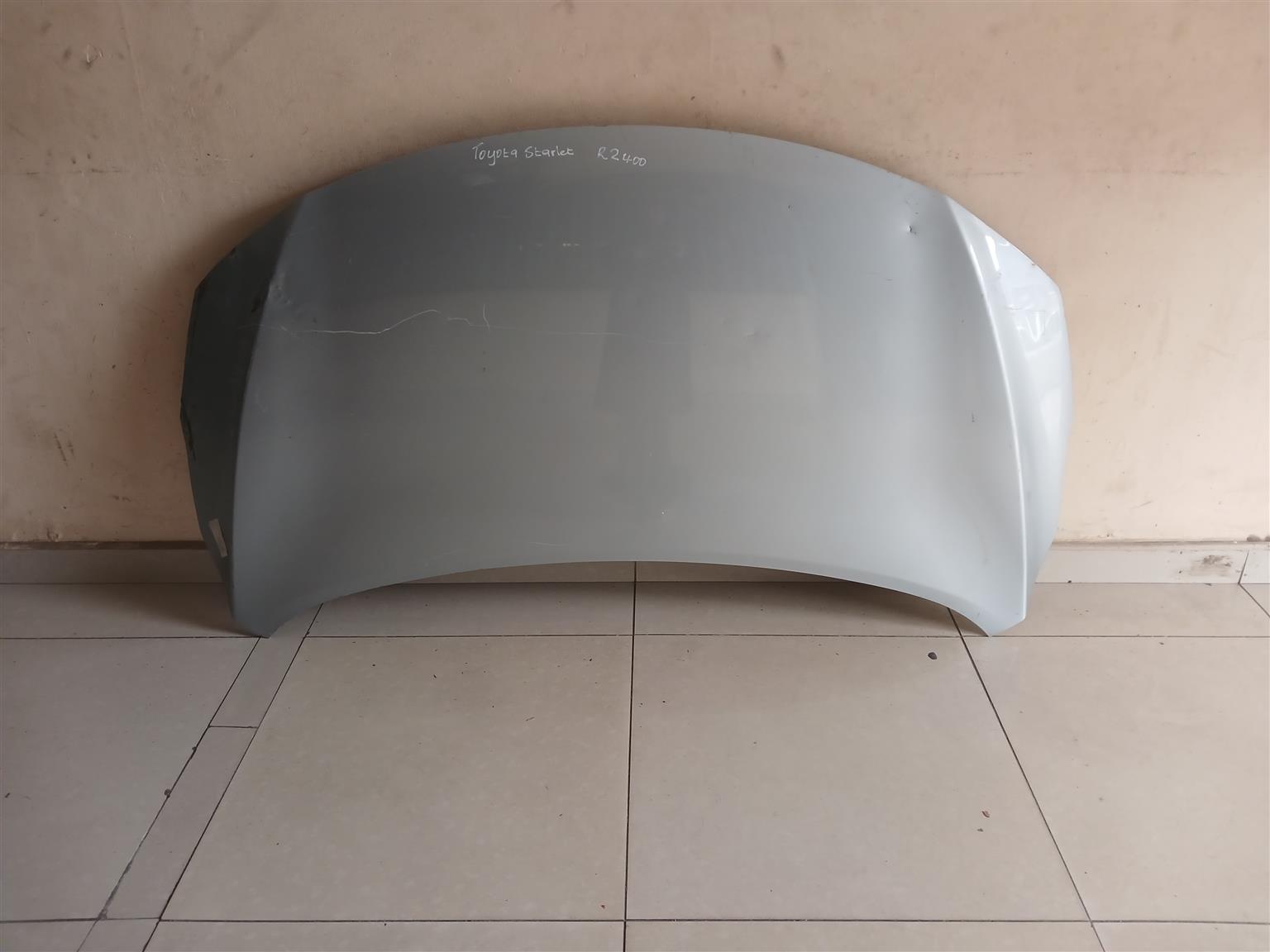 Suzuki baleno/Toyota starlet bonnet at Zuma spare parts durban - Private Seller