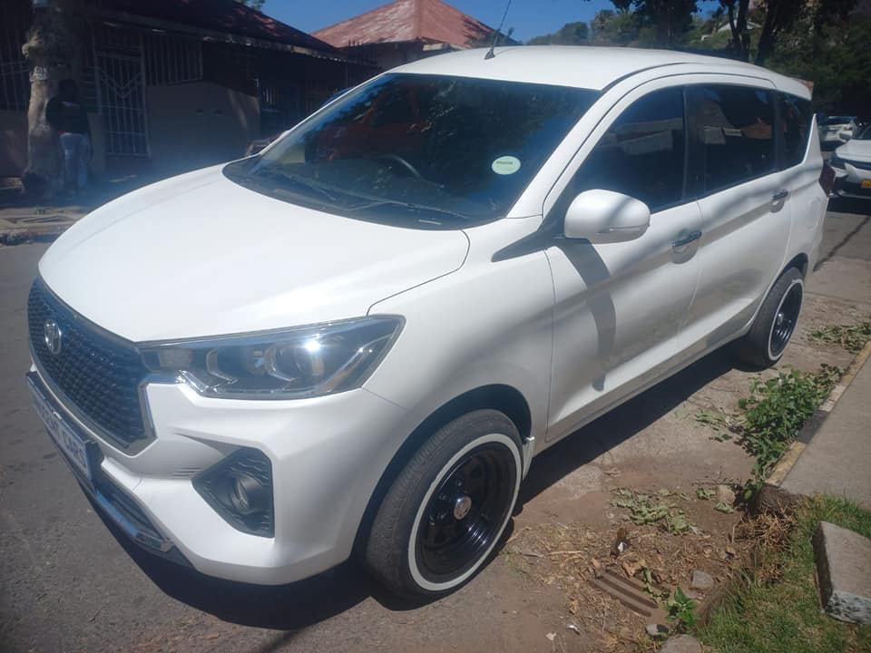 2024 TOYOTA RUMION 1.5TX PETROL, KEYLESS, MANUAL, WHITE COLOR, MILEAGE 32000KMS,