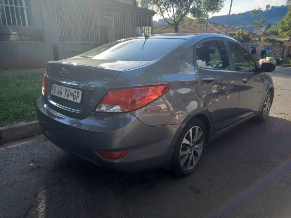 2017 HYUNDAI ACCENT SEDAN 1.6 FLUID PETROL, MANUAL, GREY, 77000kms