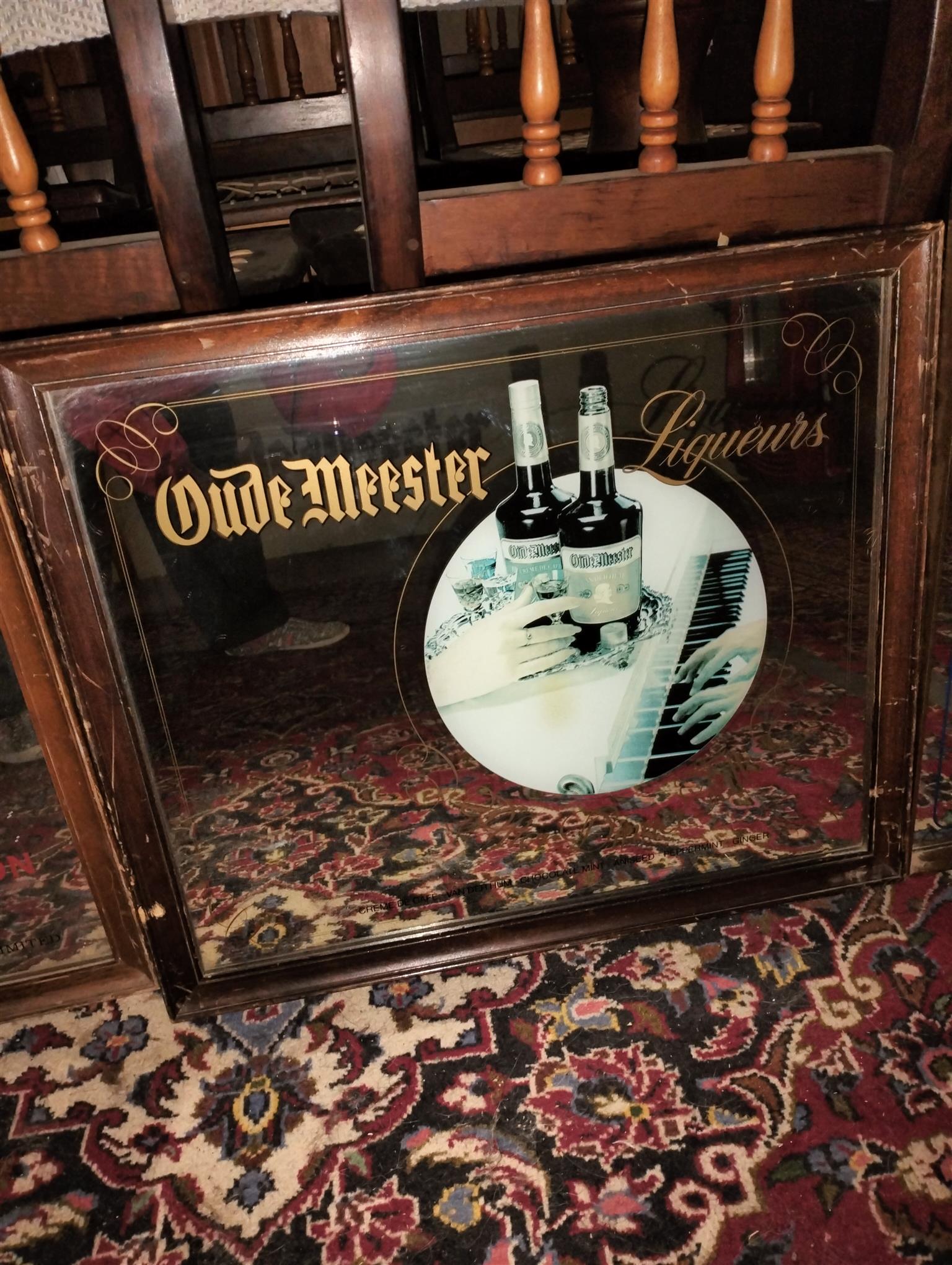 Vintage bar mirror with various alcohol logos