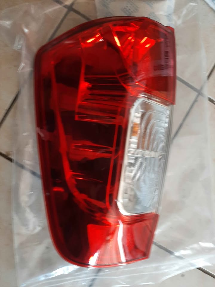 NISSAN NAVARA SINGLE CAB TAIL LIGHTS. ORIGINAL. EACH. BRAND NEW. FOR VARIOUS OTHER CARS TOO - Private Seller